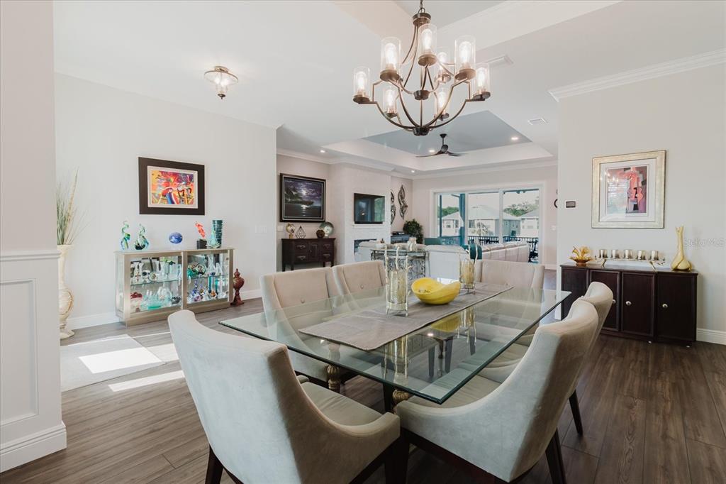 216 High Street Tarpon Springs, FL 34689 - Photo 13 of 75 a view of a dining room with furniture wooden floor and chandelier