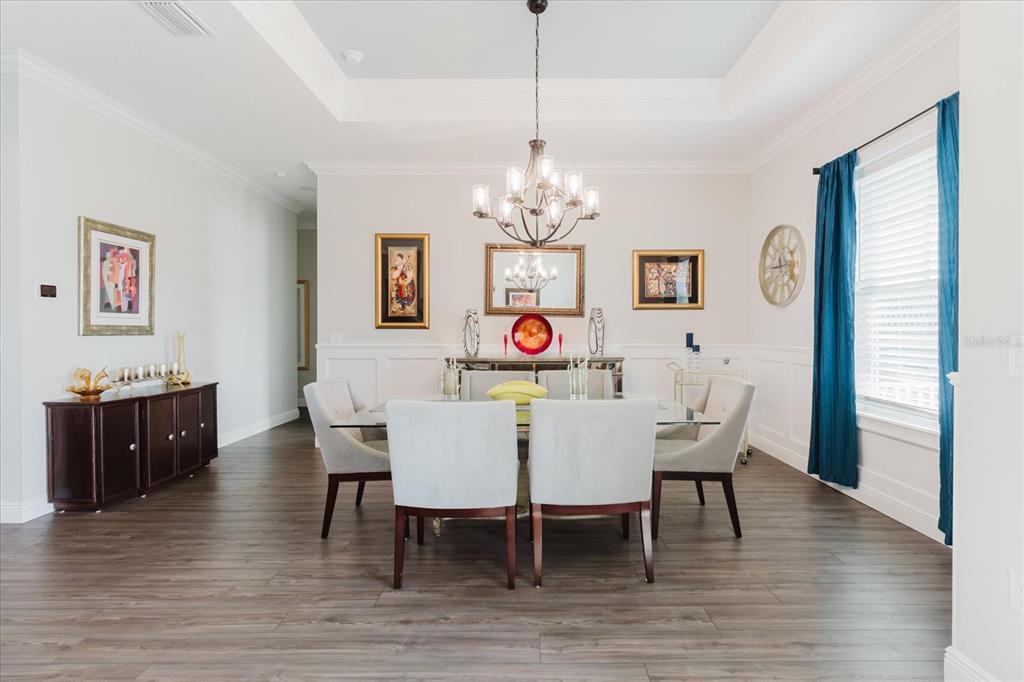 216 High Street Tarpon Springs, FL 34689 - Photo 14 of 75 a view of a dining room with furniture wooden floor and chandelier