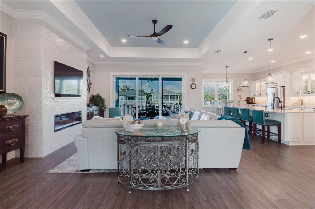 216 High Street Tarpon Springs, FL 34689 - Photo 15 of 75 a living room with fireplace furniture and a wooden floor