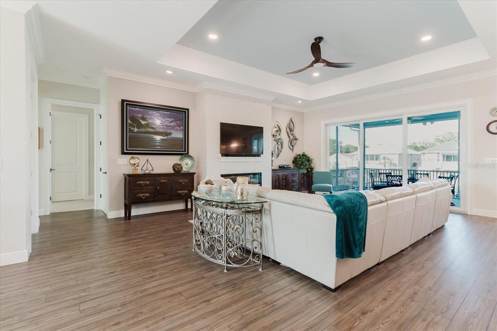 216 High Street Tarpon Springs, FL 34689 - Photo 16 of 75 a living room with furniture and a flat screen tv