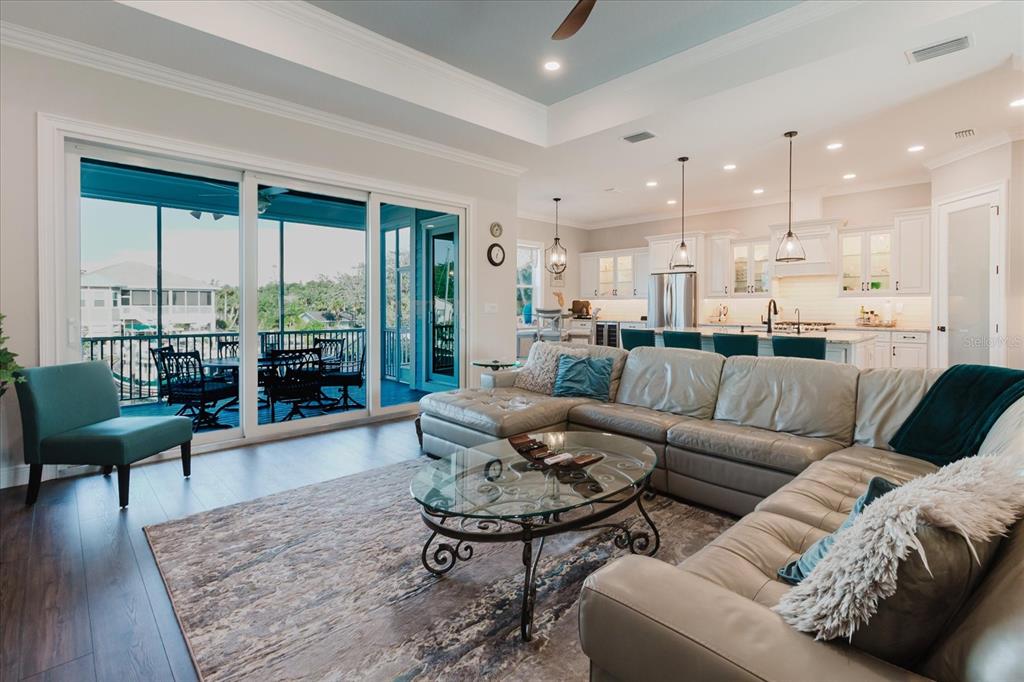 216 High Street Tarpon Springs, FL 34689 - Photo 20 of 75 a living room with furniture wooden floor and a large window