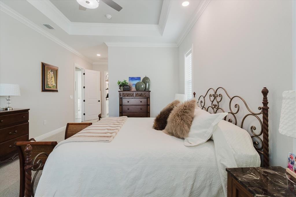 216 High Street Tarpon Springs, FL 34689 - Photo 34 of 75 a bedroom with a bed and a dresser