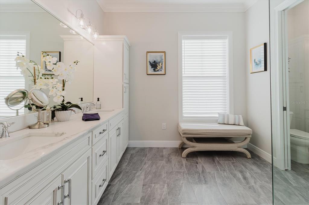 216 High Street Tarpon Springs, FL 34689 - Photo 35 of 75 a bathroom with a double vanity sink and a window