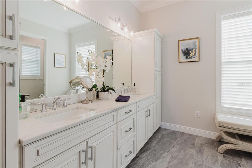 216 High Street Tarpon Springs, FL 34689 - Photo 36 of 75 a bathroom with a double vanity sink and a mirror
