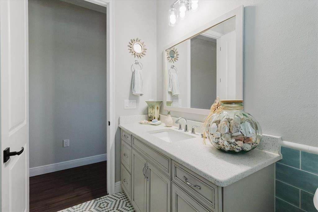 216 High Street Tarpon Springs, FL 34689 - Photo 42 of 75 a bathroom with a sink and a mirror