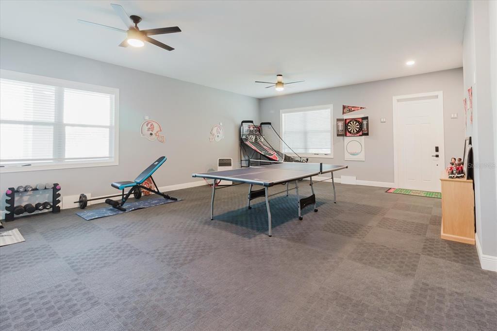 216 High Street Tarpon Springs, FL 34689 - Photo 45 of 75 a view of a workspace with gym equipment