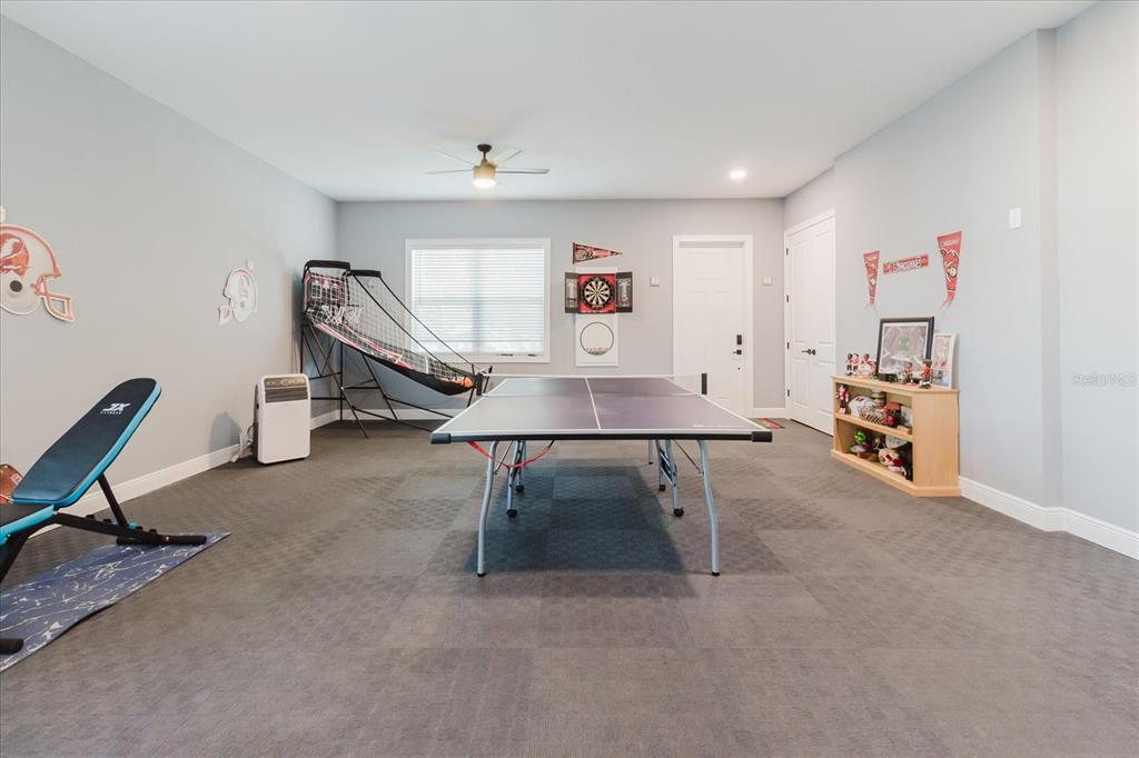 216 High Street Tarpon Springs, FL 34689 - Photo 46 of 75 a room with furniture and a wooden floor