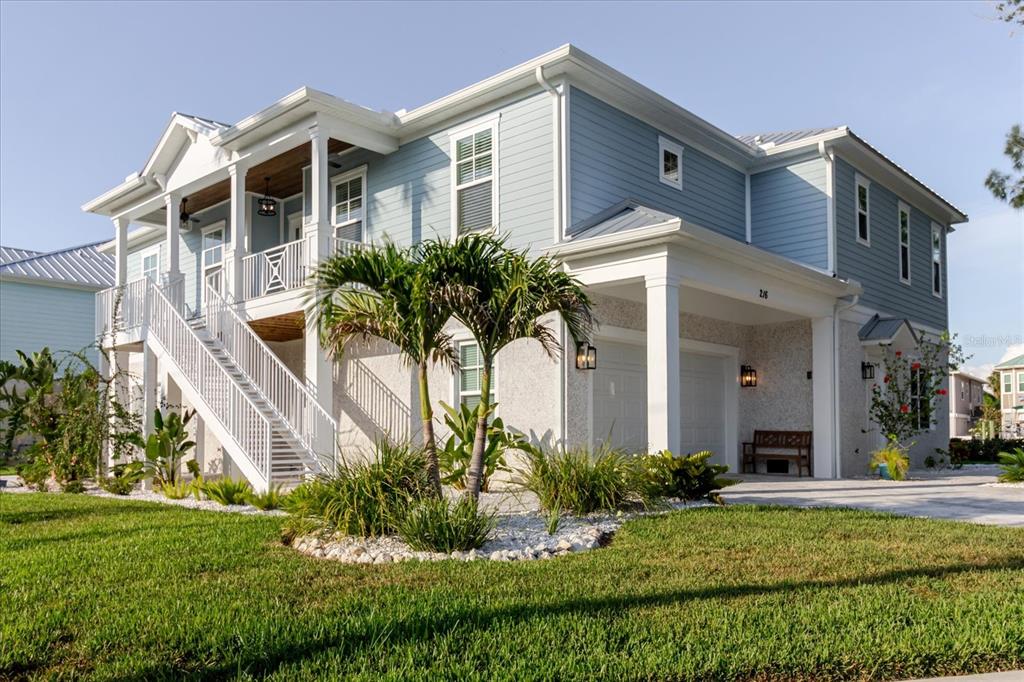 216 High Street Tarpon Springs, FL 34689 - Photo 5 of 75 a front view of a house with a yard
