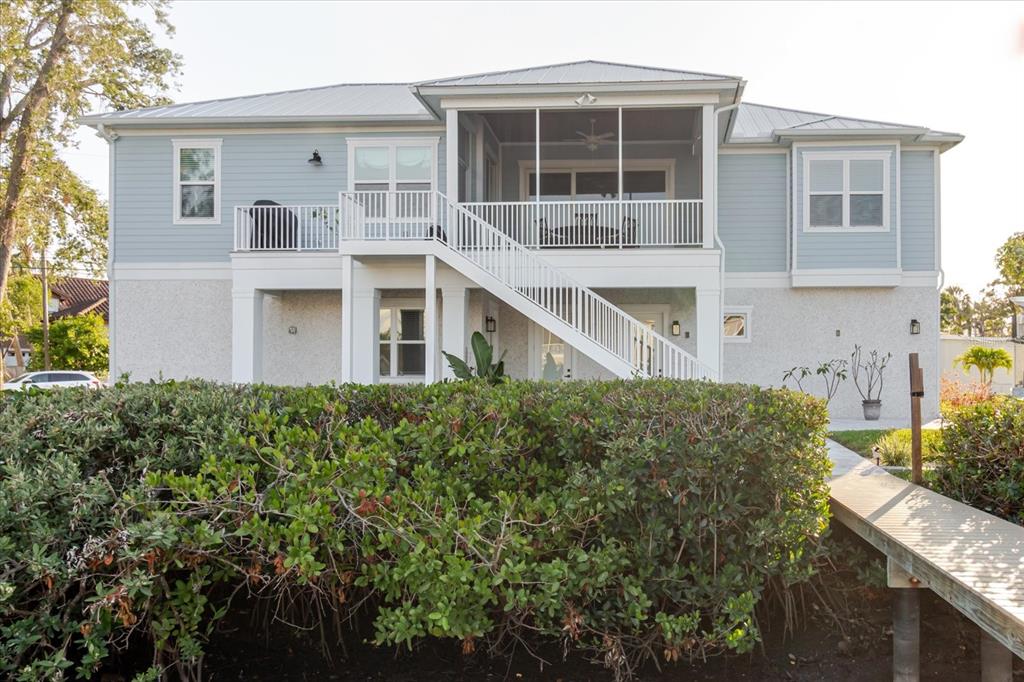 216 High Street Tarpon Springs, FL 34689 - Photo 53 of 75 a front view of a house with a garden
