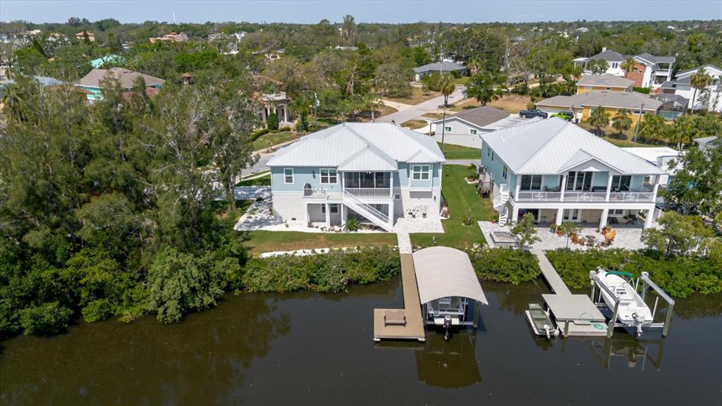 216 High Street Tarpon Springs, FL 34689 - Photo 59 of 75 a aerial view of a house with a garden and lake view