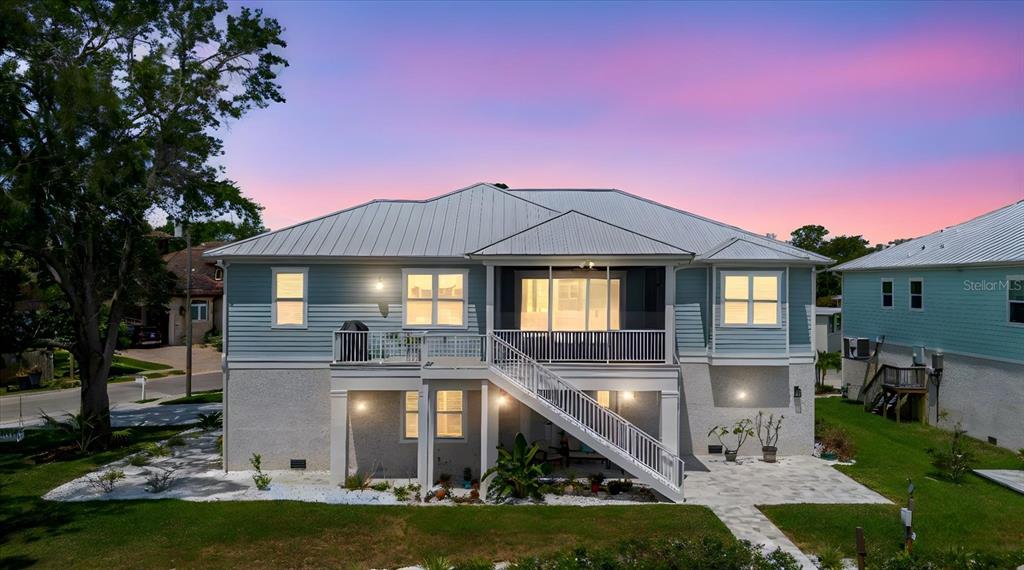 216 High Street Tarpon Springs, FL 34689 - Photo 75 of 75 a front view of a house with a yard