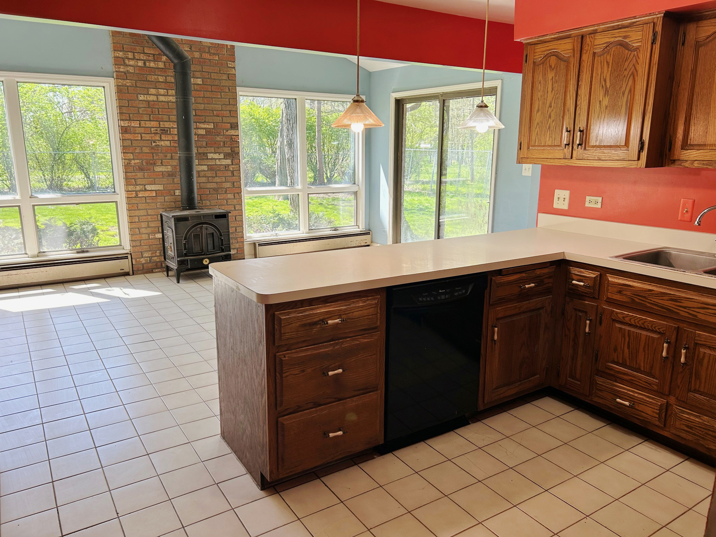 3413 East Bemes Road Crete, IL 60417 - Photo 16 of 29 a kitchen with a sink window and cabinets