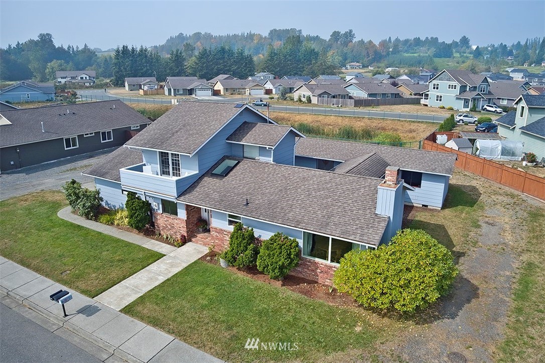2452 Douglas Road Ferndale, WA 98248 - Photo 1 of 27 an aerial view of a house with a garden and a yard