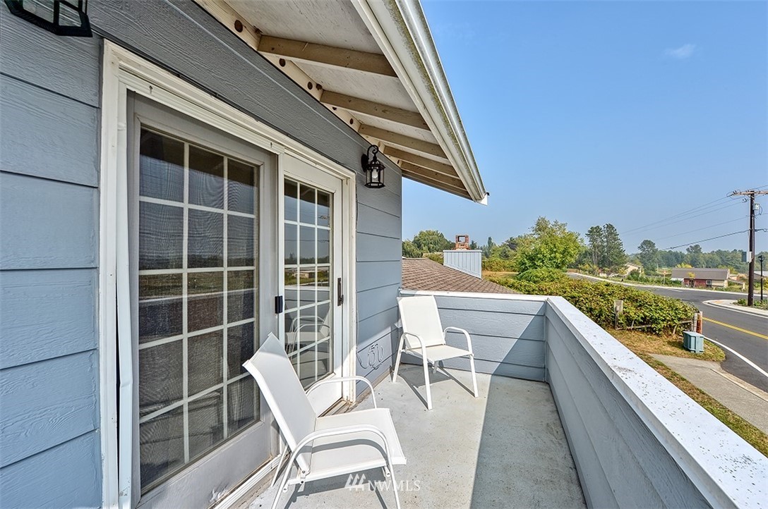 2452 Douglas Road Ferndale, WA 98248 - Photo 14 of 27 a balcony with table and chairs