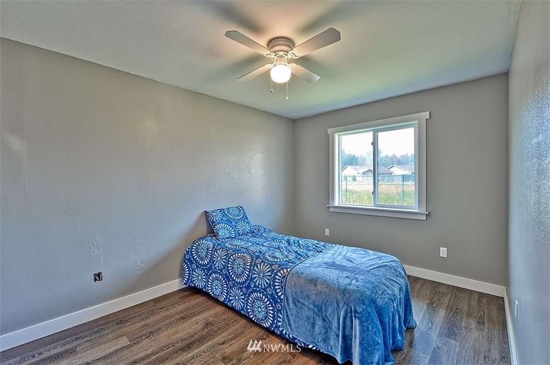 2452 Douglas Road Ferndale, WA 98248 - Photo 22 of 27 a bedroom with a bed and a window