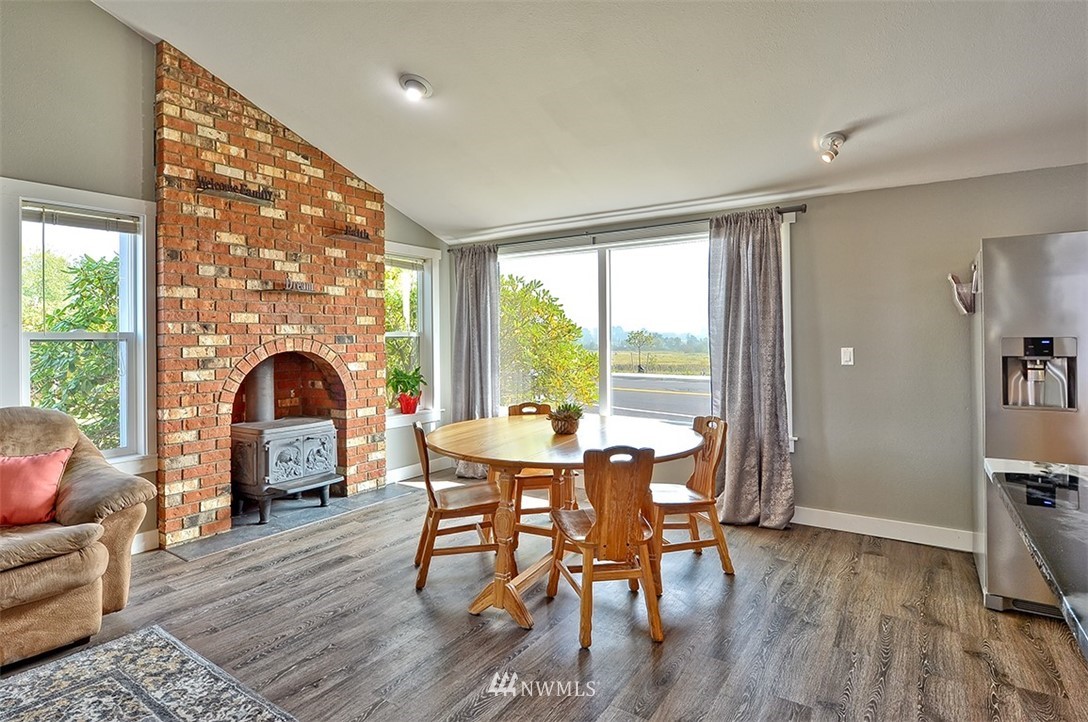 2452 Douglas Road Ferndale, WA 98248 - Photo 7 of 27 a view of a dining room with furniture window and wooden floor