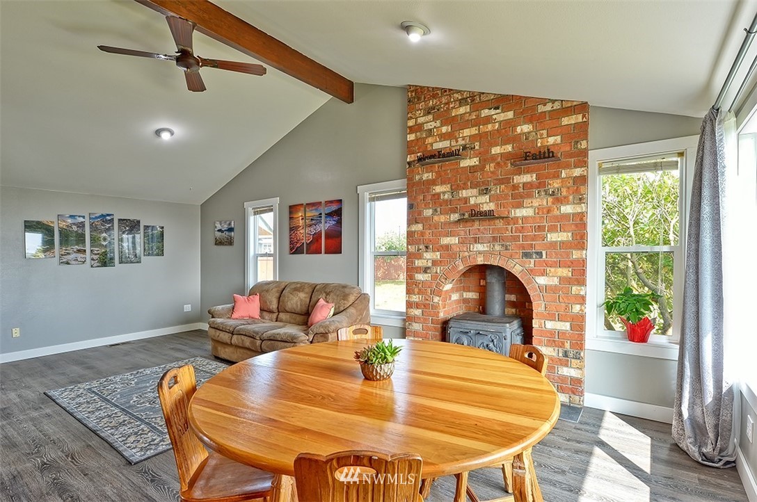 2452 Douglas Road Ferndale, WA 98248 - Photo 8 of 27 a dining room with a table or chandelier and a wooden floor