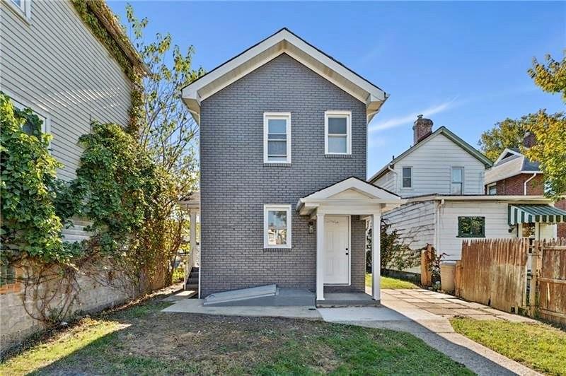 front view of a house with a yard