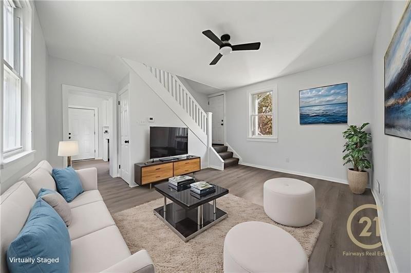 233 East 19th Avenue Homestead, PA 15120 - Photo 12 of 27 a living room with furniture and a flat screen tv