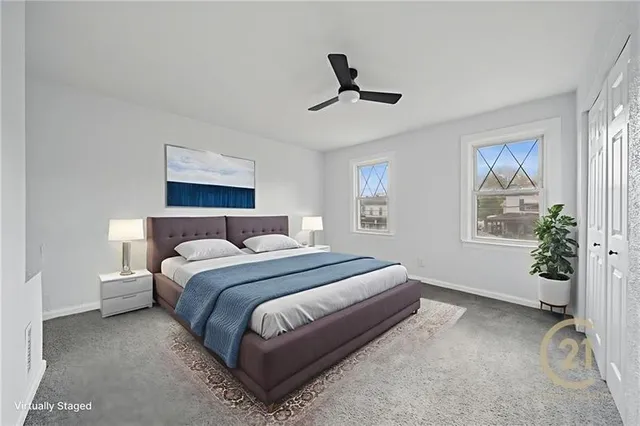 a bedroom with a bed lamp and a window