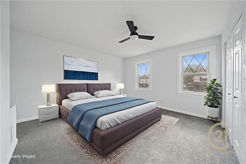 233 East 19th Avenue Homestead, PA 15120 - Photo 26 of 27 a bedroom with a bed lamp and a window