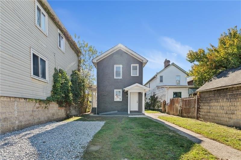 233 East 19th Avenue Homestead, PA 15120 - Photo 27 of 27 a front view of a house with a yard