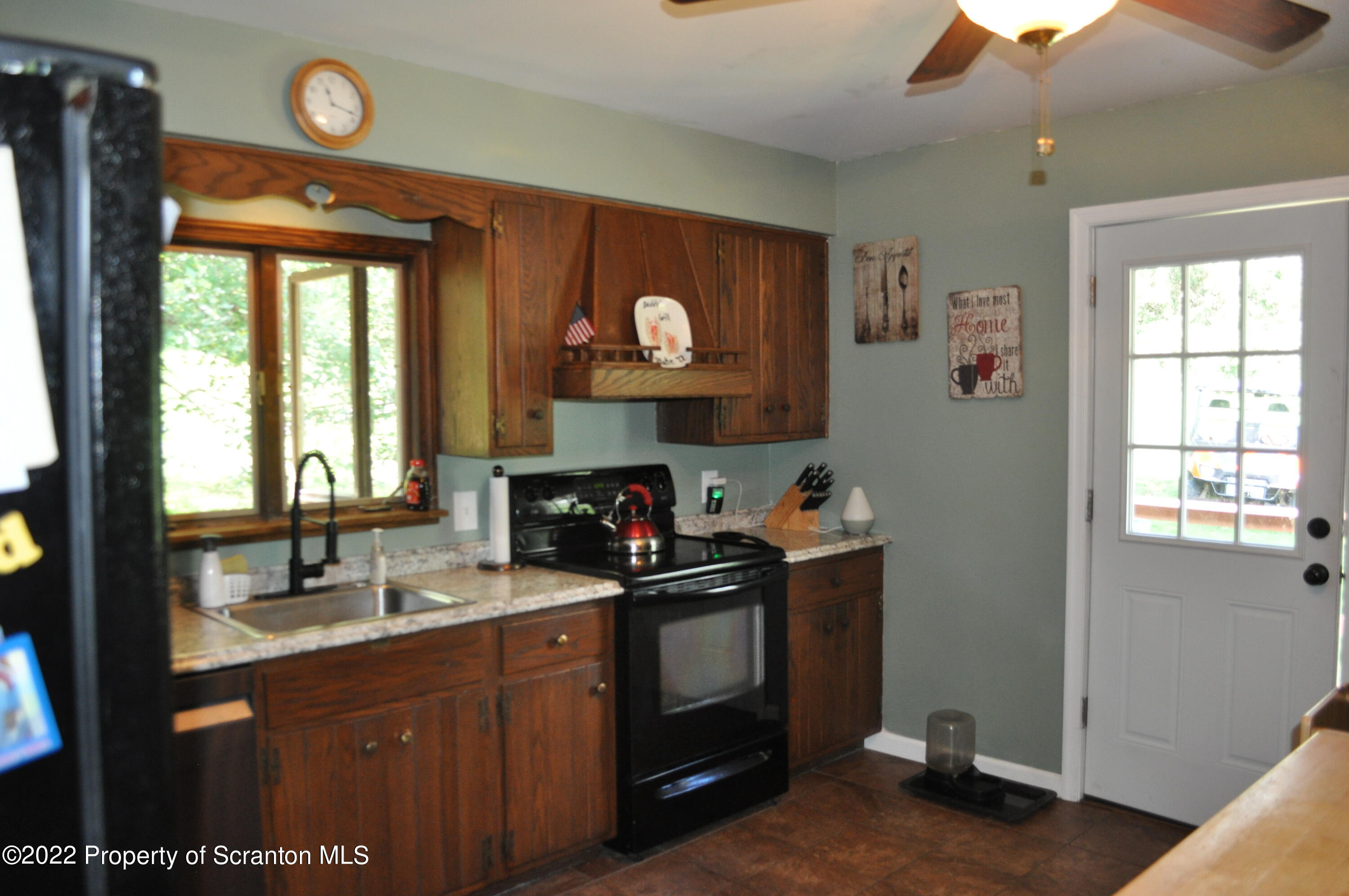 24 Prompton Road Prompton, PA 18456 - Photo 7 of 22 Kitchen leading to side deck