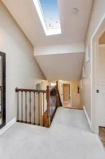 a living room with furniture and next to a window