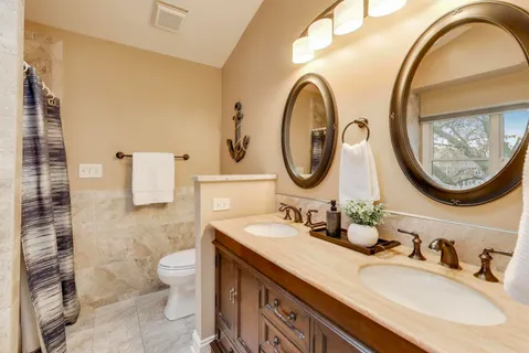 a white bath tub sitting next to a window