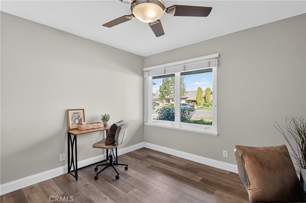 1610 East 20th Street Santa Ana, CA 92705 - Photo 16 of 43 a workspace with furniture a window and wooden floor