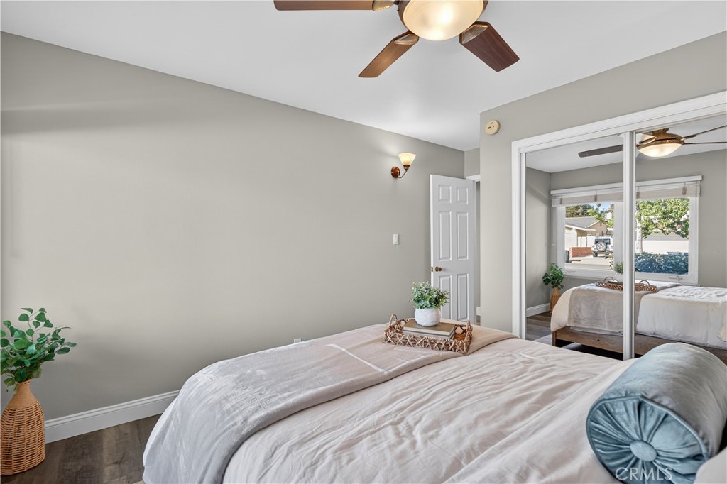 1610 East 20th Street Santa Ana, CA 92705 - Photo 19 of 43 a bedroom with a large bed and a potted plant