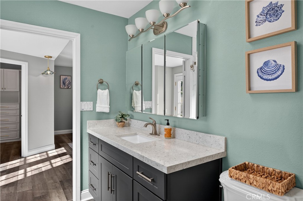 1610 East 20th Street Santa Ana, CA 92705 - Photo 22 of 43 a bathroom with a sink a vanity and a mirror