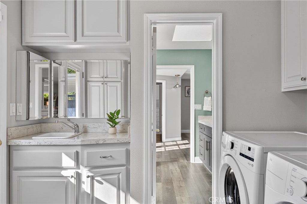 1610 East 20th Street Santa Ana, CA 92705 - Photo 25 of 43 a view of living room with washer and dryer