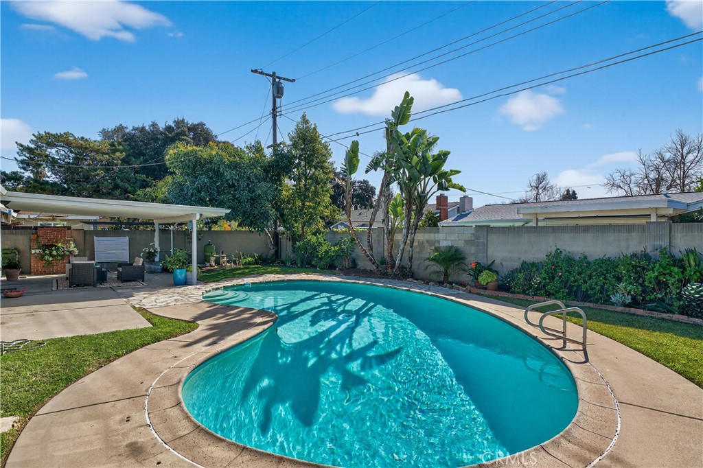 1610 East 20th Street Santa Ana, CA 92705 - Photo 33 of 43 a swimming pool with outdoor seating and yard