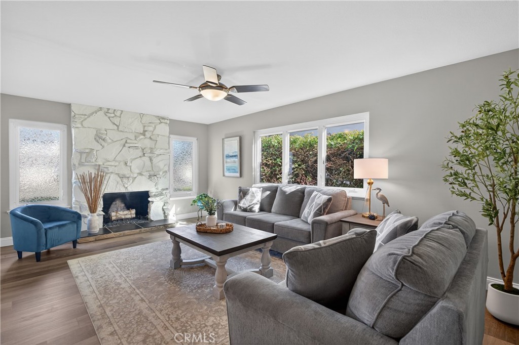1610 East 20th Street Santa Ana, CA 92705 - Photo 4 of 43 a living room with furniture a fireplace and a large window