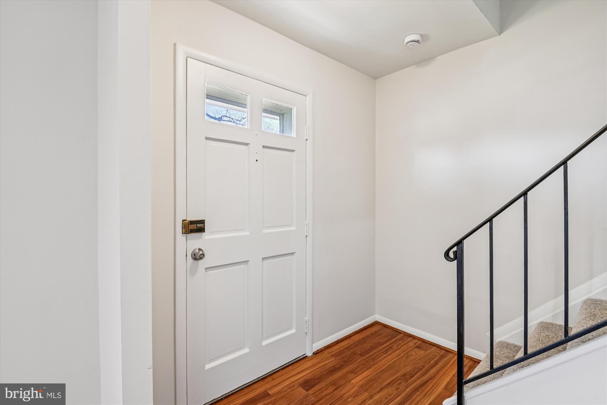 729 Chapelgate Drive Odenton, MD 21113 - Photo 20 of 64 a view of a hallway with wooden floor