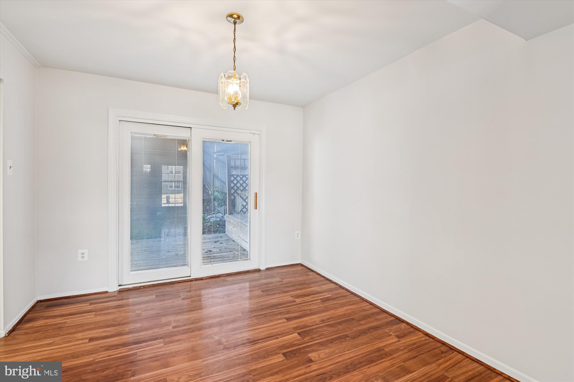 729 Chapelgate Drive Odenton, MD 21113 - Photo 25 of 64 a view of an empty room with wooden floor and a window