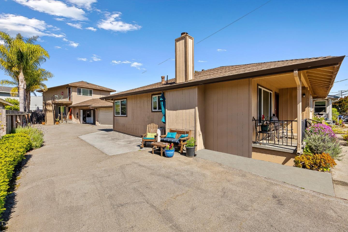 a view of a house with patio and sitting area
