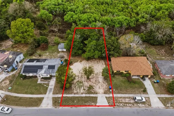 an aerial view of a houses with outdoor space