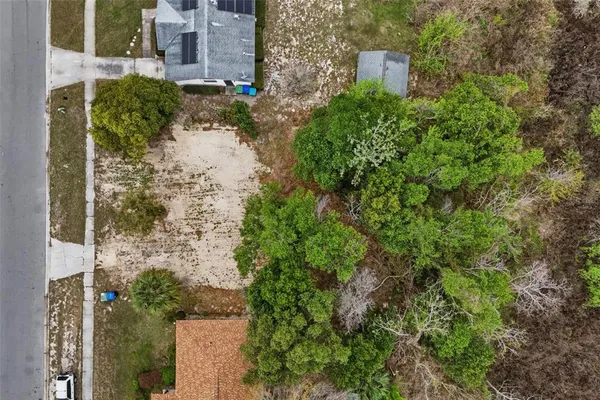 an aerial view of a house with a garden