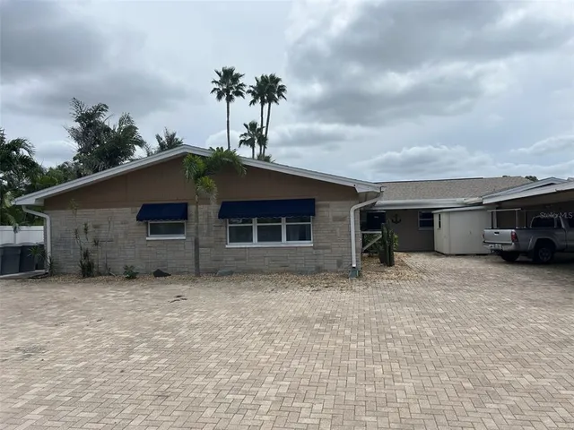 a house with trees in the background