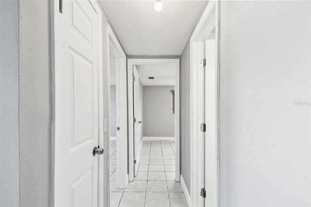 5410 Quist Drive Port Richey, FL 34668 - Photo 15 of 99 a view of a bathroom with a glass door