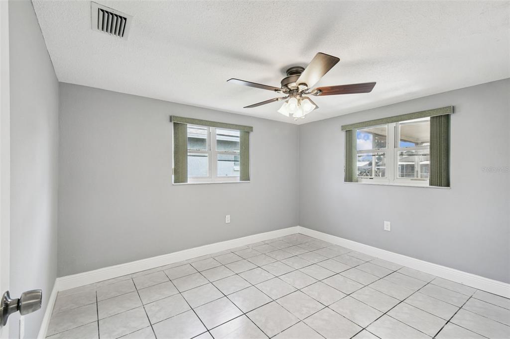 5410 Quist Drive Port Richey, FL 34668 - Photo 18 of 99 a view of an empty room with a window