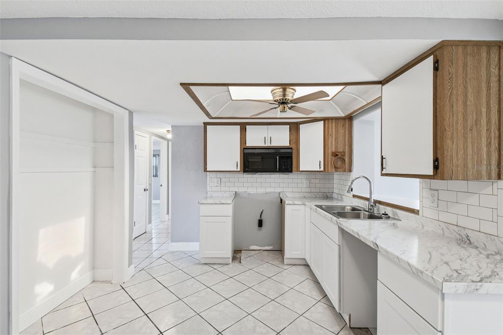 5410 Quist Drive Port Richey, FL 34668 - Photo 26 of 99 a spacious bathroom with a granite countertop sink mirror and