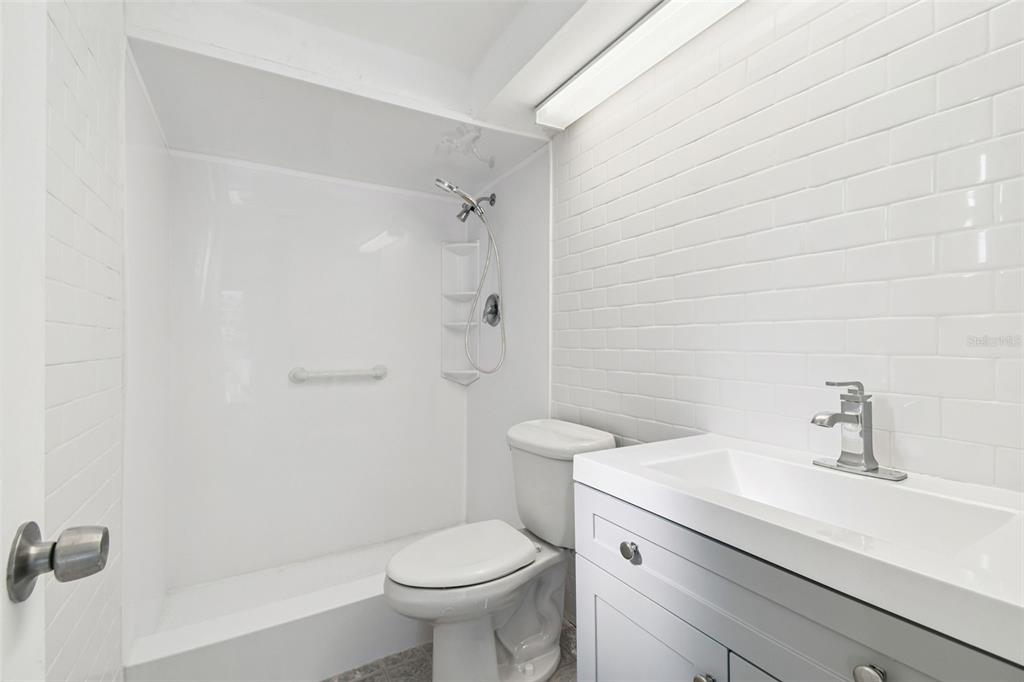 5410 Quist Drive Port Richey, FL 34668 - Photo 36 of 99 a bathroom with a sink toilet and shower