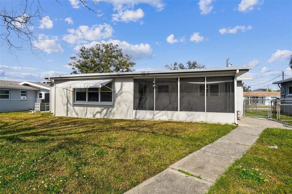 5410 Quist Drive Port Richey, FL 34668 - Photo 46 of 99 a view of a house with a swimming pool