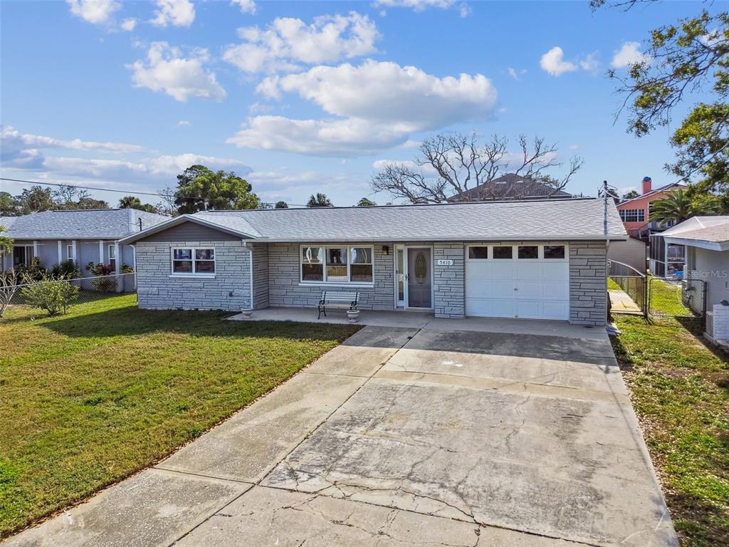 5410 Quist Drive Port Richey, FL 34668 - Photo 48 of 99 a view of a house with a swimming pool