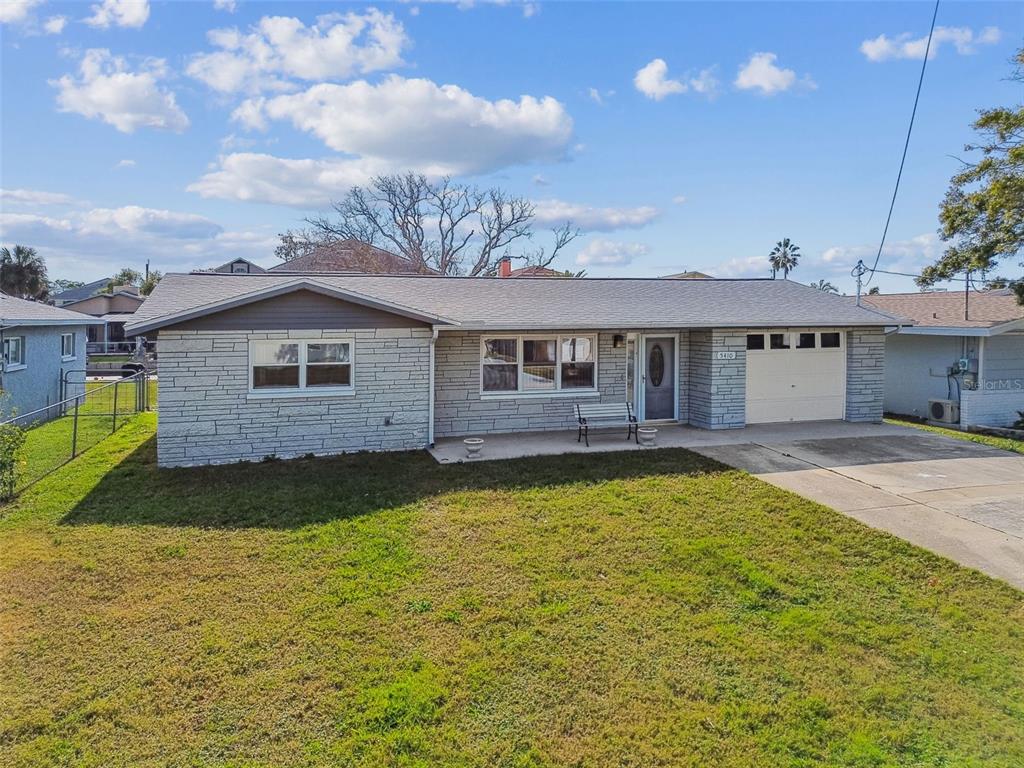 5410 Quist Drive Port Richey, FL 34668 - Photo 50 of 99 a view of a house with swimming pool and sitting area