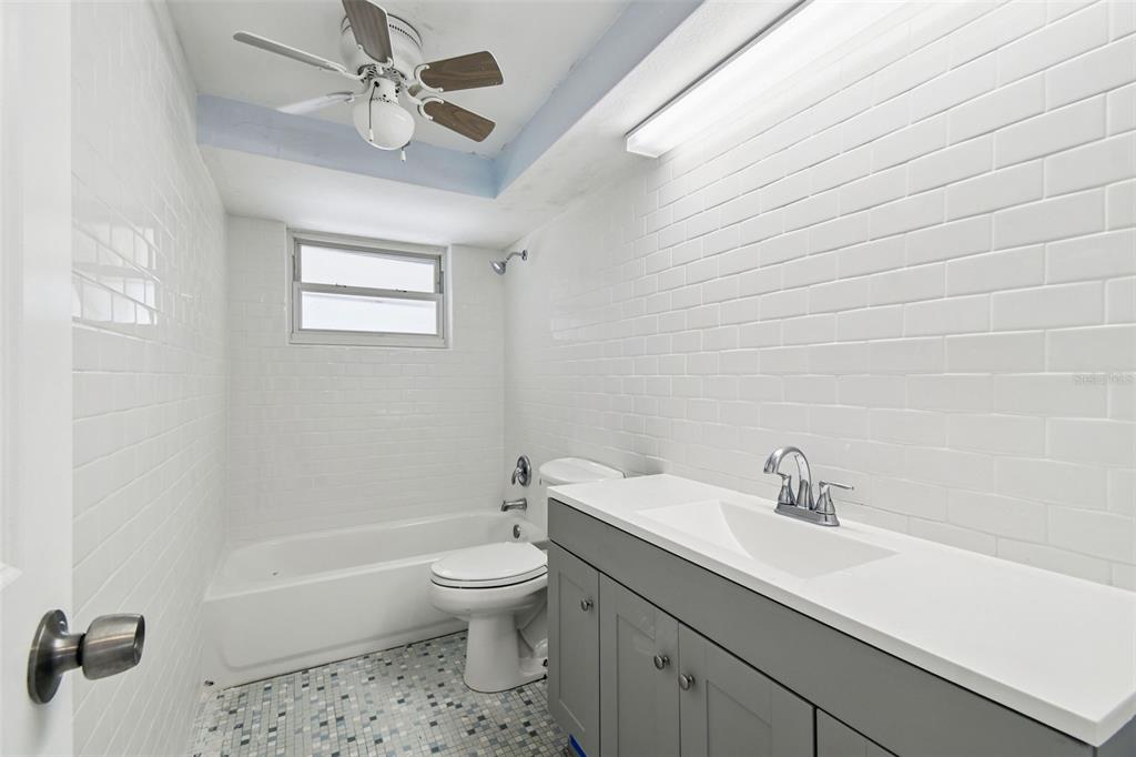 5410 Quist Drive Port Richey, FL 34668 - Photo 5 of 99 a bathroom with a sink a toilet and a bathtub