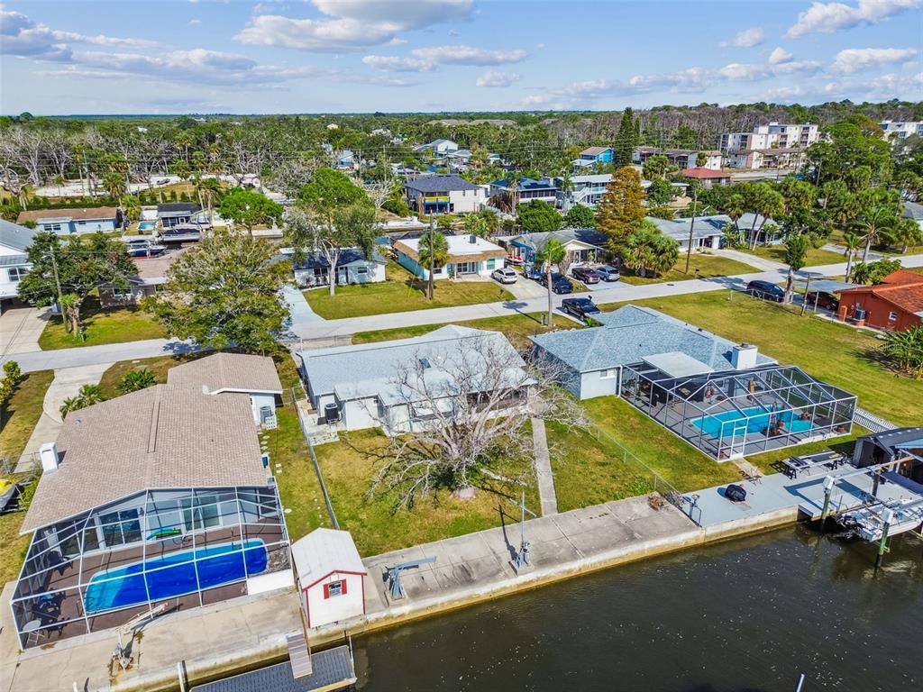 5410 Quist Drive Port Richey, FL 34668 - Photo 62 of 99 an aerial view of residential houses with outdoor space and swimming pool